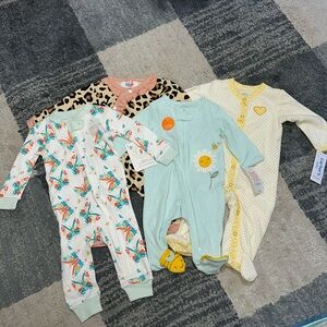 Bundle of four baby girl sleepers